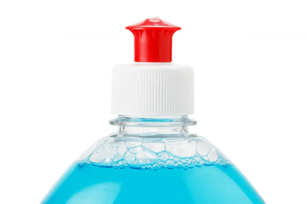 Bottle of blue transparent dish washing liquid, close up